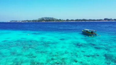 Vibrant turquoise seaside view. Journey to Gili Trawangan, Thailand.