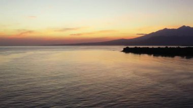 Sunset by the seaside. Tropical nature of Bali, Indonesia. 