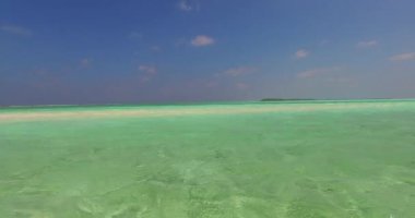 Coastal area with clear shallow water. Enjoying nature of Bali, Indonesia. 