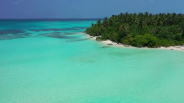 Tropical island in bright turquoise sea. Enjoying nature of Bali, Indonesia. 