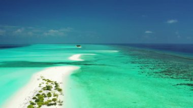 Tropical island in bright turquoise sea. Enjoying nature of Bali, Indonesia. 