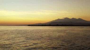 Sunset by the seaside. Tropical nature of Bali, Indonesia. 