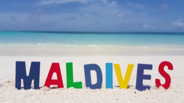 Colored text from blocks on the beach. Enjoying nature of Dominican Republic, Caribbean.   