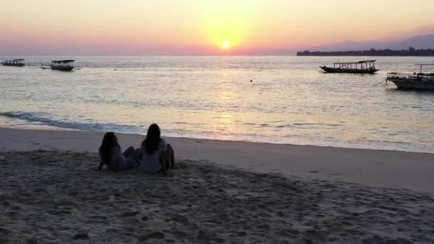 Two Girls Sitting Sandy Beach — Stock Video