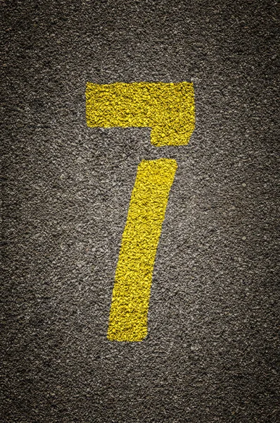 Stencil numbers print on asphalt background — Stock Photo, Image