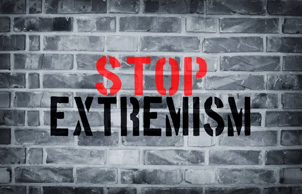 Stop Extremism estampado de plantilla en la pared de ladrillo blanco grunge — Foto de Stock