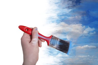 Beyaz arka plan üzerinde izole paintbrush resim gökyüzü ile el