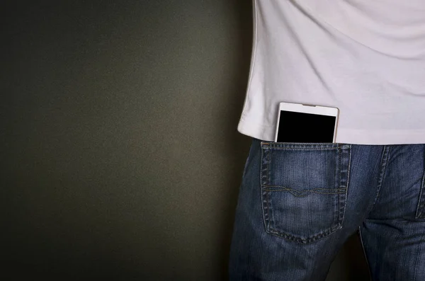 Smart phone in jeans pocket