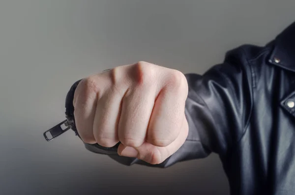 Male fist on grey background — Stock Photo, Image