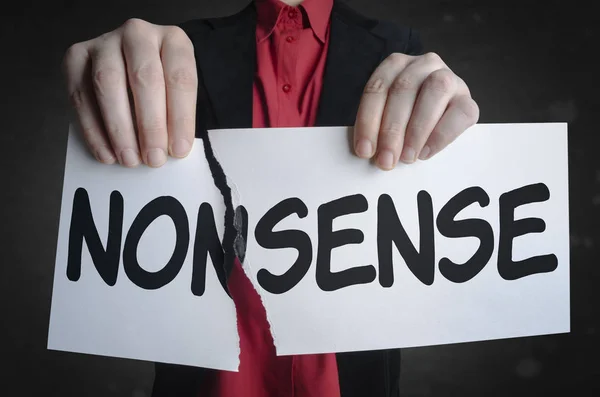 Businessman tearing up a sign saying - Nonsense — Stock Photo, Image