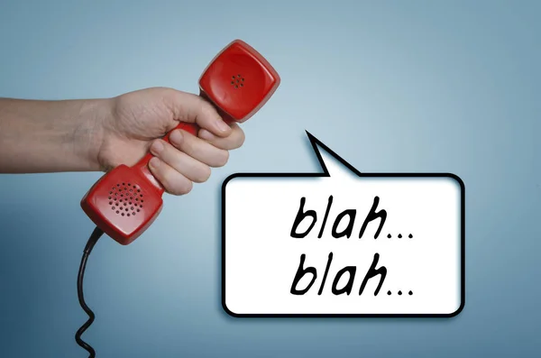 Blah..blah..blah..hand with old red phone — Stock Photo, Image