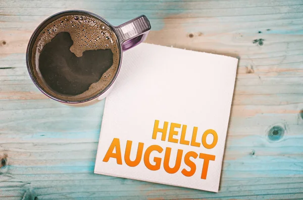 stock image Hello august note on a napkin with a cup of coffee