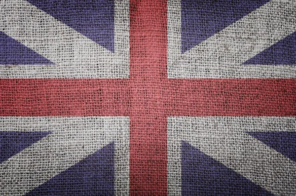 Britse vlag op jute achtergrondstructuur — Stockfoto