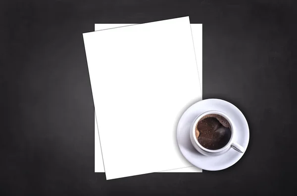 Blank letterhead and coffee cup on black table background. — Stock Photo, Image