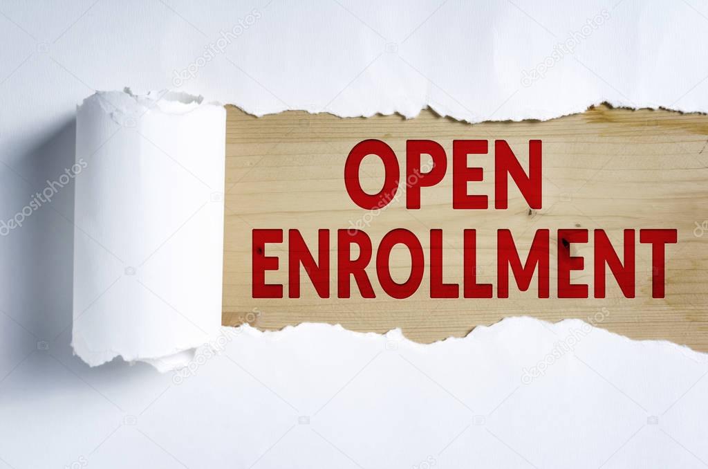Torn paper with OPEN ENROLLMENT in opening background