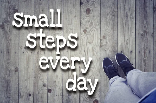 Sport active lifestyle concept. Motivational text "Small steps e — Stock Photo, Image