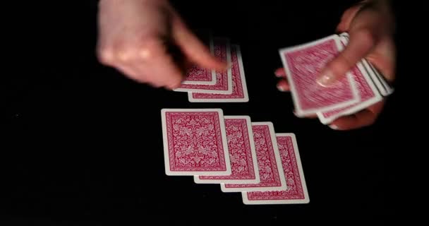 Lidando com cartas de poker em fundo preto — Vídeo de Stock
