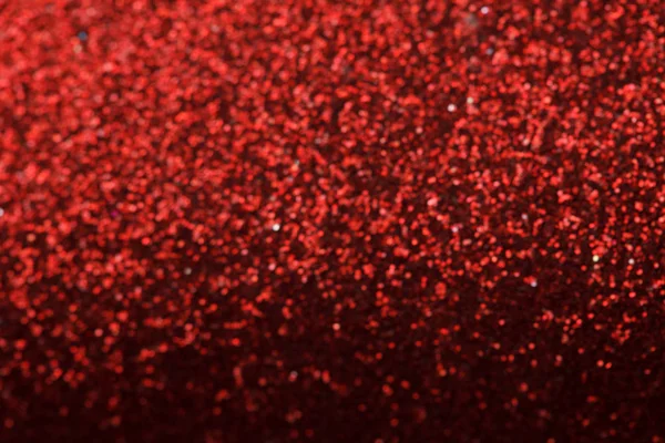 Red glitter texture christmas background.