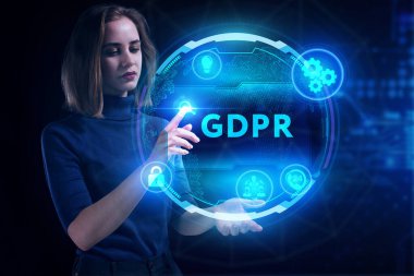 İş, Teknoloji, İnternet ve ağ konsepti. Genç işadamı geleceğin sanal ekranı üzerinde çalışıyor ve GDPR yazısını görüyor.
