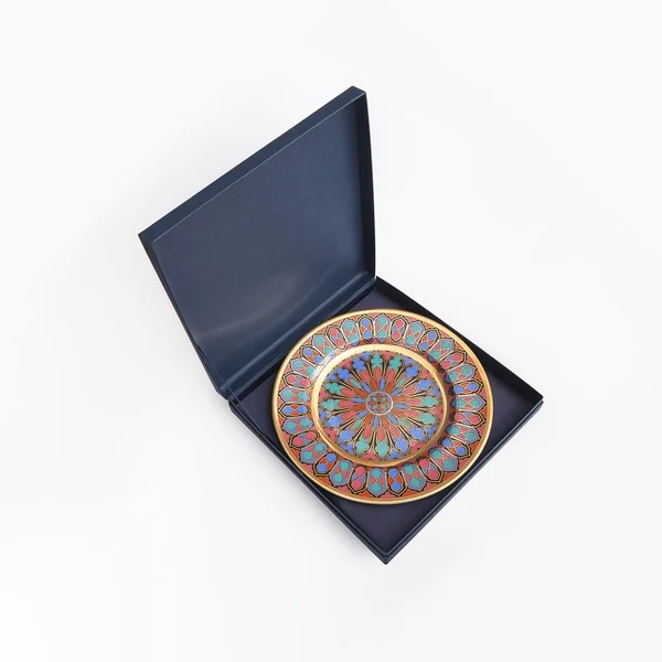 Porcelan plate in blue box — Stock Photo, Image