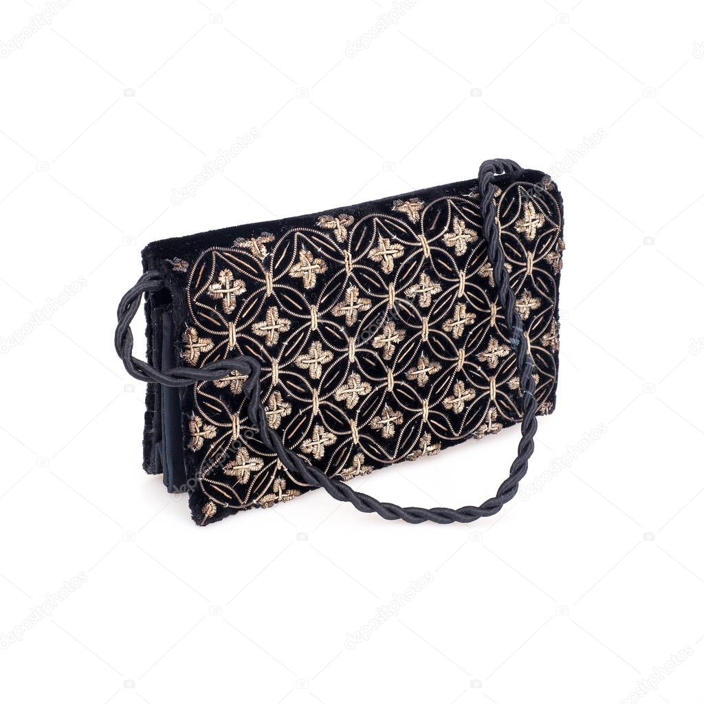 Black velvet clutch with gold embroidery isolated on white background