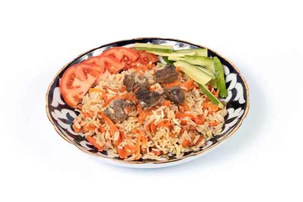 Pilaf with fresh vegetables and meat on a white plate for menu and web — Stock Photo, Image