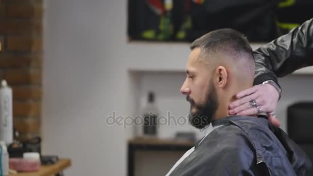 Serious Young Bearded Man Getting Haircut By Barber. Barbershop Theme. Slow motion. — Stock Video
