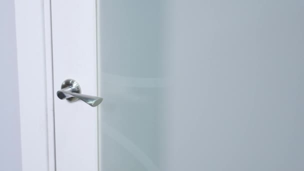 Woman hand white door handle close-up — Stock Video