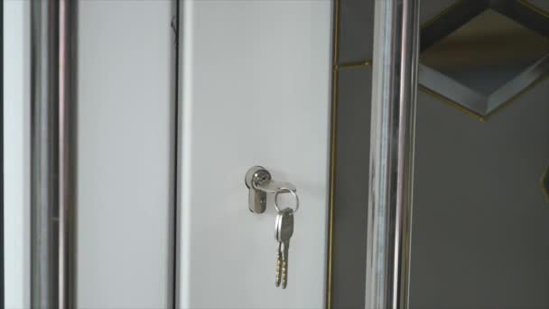 Locking up or unlocking door with key in hand — Stock Video