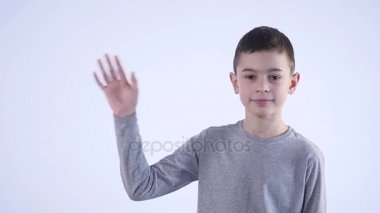 genç çocuk elini üzerinde beyaz bir arka plan dalgalar.