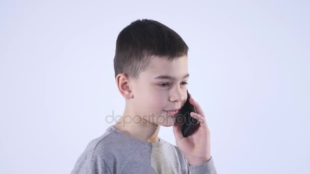 Little Boy Having a Phone Call Isolated on White Background — Stock Video