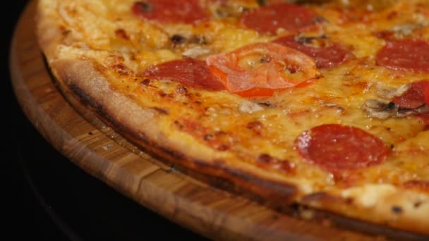 Rotating Pizza display on black backround — Stock Video