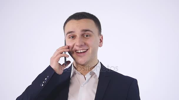 Portrait of casual businessman talking on mobile phone. Isolated on white — Stock Video