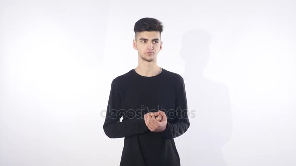 Young funny looking man, nervously denying mistake he made, feels guilty, ashamed actions, embarrassed isolated white background. Negative emotion, facial expression, feeling reaction — Stock Video