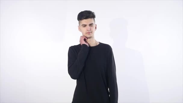 Attractive model on white background having neck pain — Stock Video