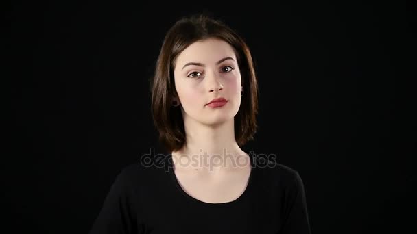 Thumbs up woman Happy giving success hand sign smiling happy and joyful winking. isolated on black background in studio — Stock Video