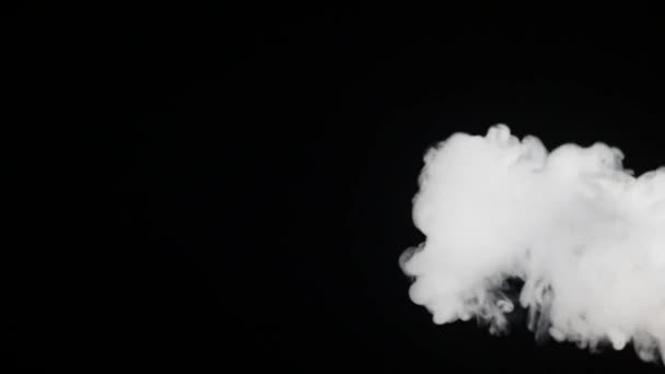 White Smoke floats over black background — Stock Video