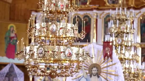 Big bronze chandelier in cathedral christian church — Stock Video