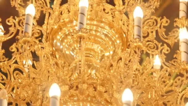 Big bronze chandelier in cathedral christian church — Stock Video