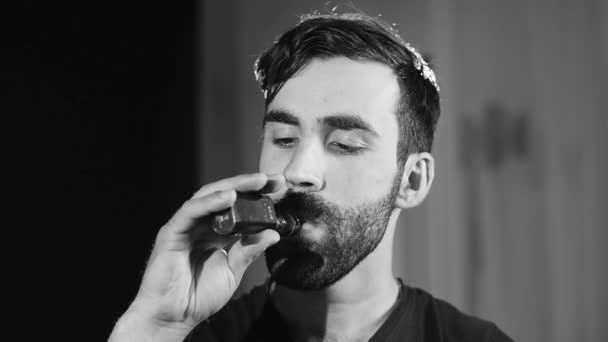 Vaping man holding a mod. A cloud of vapor. Black background Black and white — Stock Video