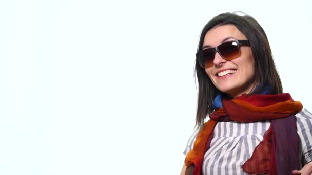 Funny Girl hamming to the camera. Girl standing in the studio on a white background — Stock Video