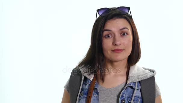 Happy travel young girl taking picture isolated over white background — Stock Video