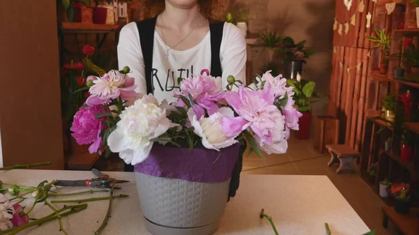 Flower Shop, Florist Arranging Modern Bouquet, young handsome florists work at flowers shop making bouquet