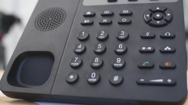 Hand dials the number on the telephone. Womans hand dials the number close-ups — Stock Video