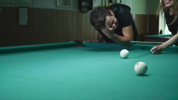 Man Showing His Girl Where To Hit The Ball - Young Woman Receiving Advice On Shooting Pool Ball While Playing Billiards — Stock Video