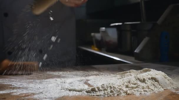 The chefs hands roll the dough into pizza. slow motion — Stock Video