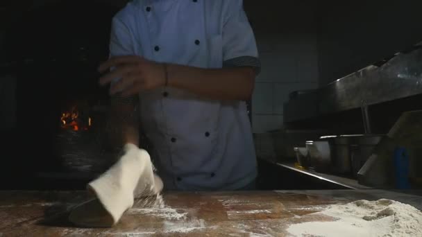 Chefs rotate pizza dough in the air — Stock Video