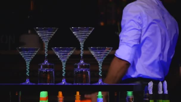 Male bartender juggling bottle and make cocktail. Barman show, clear shots, man professional bartender. slow motion. selective focus. close up — Stock Video