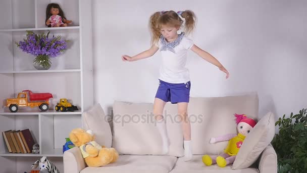 Happy children jumping on the bed and having fun — Stock Video