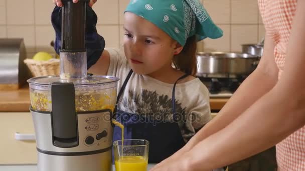 Mother and daughter baking together at home in the kitchen — Stock Video